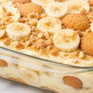 Unbelievably Creamy Gluten-Free Banana Pudding! Discover the ultimate gluten-free banana pudding! Layers of creamy vanilla, sweet bananas, and crisp GF wafers.