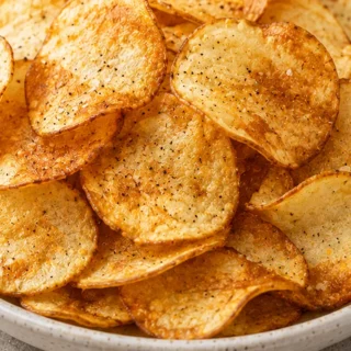 Crispy Homemade Potato Chips: The Ultimate Snack Hack! Potato Chips: Make the ultimate crispy, gluten-free potato chips at home in under an hour. Easy air fryer