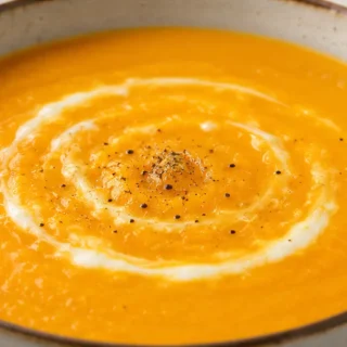 " Creamy Carrot Ginger Soup: Comforting & Easy" - Carrot ginger soup: craft this vibrant and warming dish in under an hour. Perfect for a healthy, comforting me
