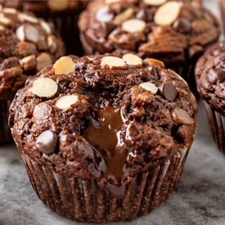 Gooey Chocolate Almond Muffins - chocolate muffins - Chocolate muffins: bake these incredibly moist and fudgy almond butter muffins. Gluten-free and packed with