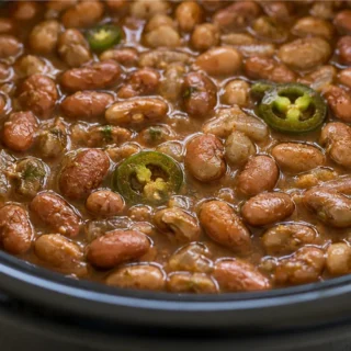 ️ Ultimate Slow-Cooker Pinto Beans - Pinto beans: craft these incredibly creamy and flavorful slow-cooker pinto beans. Easy prep for a delicious Mexican-inspire