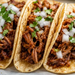Juicy Slow-Cooker Sweet Pork Tacos - Sweet pork tacos: make this tender, flavorful slow-cooker dish for an easy weeknight meal. Perfect for feeding a crowd with