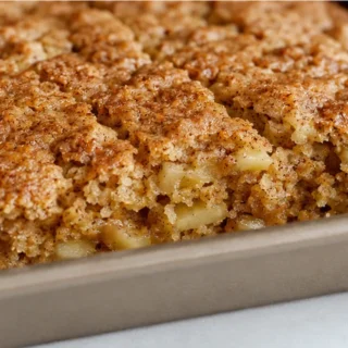 Cozy Applesauce Cake - Applesauce cake: bake this tender, spiced dessert with a homemade applesauce base. Topped with a luscious white chocolate ganache, perfec