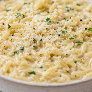 Dreamy Creamy Parmesan Garlic Orzo - creamy orzo - Creamy orzo: master this quick and delightful garlic parmesan side dish. Perfect with a hint of lemon, it's a