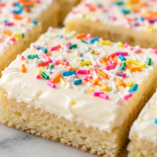 Gluten-Free Frosted Sugar Cookie Bars - gluten free sugar cookie bars - Gluten free sugar cookie bars: bake this easy frosted recipe with vibrant sprinkles. Per