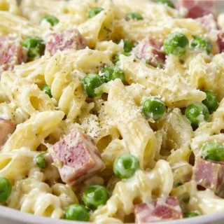 Creamy Ham & Pea Pasta: Your New Weeknight Obsession! - ham and pasta - Ham and pasta: whip up this quick and creamy skillet dish with tender ham, sweet peas, a