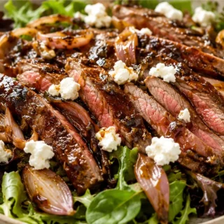 Sizzle & Crunch Steak Salad - Steak salad: master this flavorful recipe featuring juicy strip steak, crispy shallots, and a tangy maple balsamic vinaigrette. Id