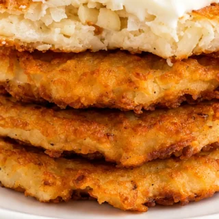 Crispy Gluten-Free Potato Latkes - gluten-free latkes - Gluten-free latkes: savor the crispy, golden goodness of these potato delights. Enjoy them hot, fresh, a